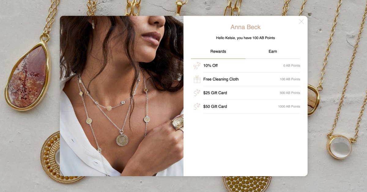 Anna Beck's loyalty widget on a background showcasing some of the brand's jewlery