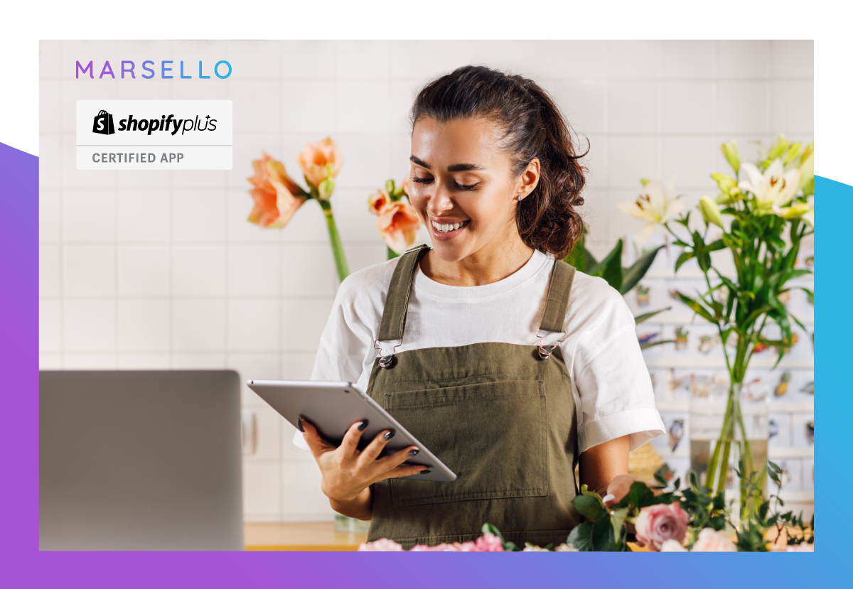 Woman using at IPad from behind a shop counter with purple and blue marsello brand colours bordering the image.