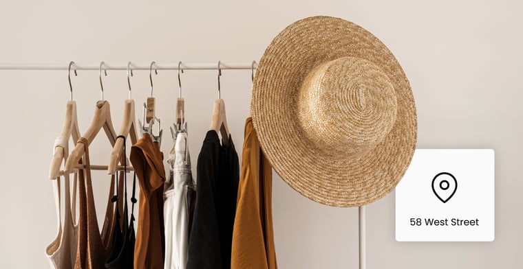 Clothes Rack with Women's clothing and a pin icon with an address