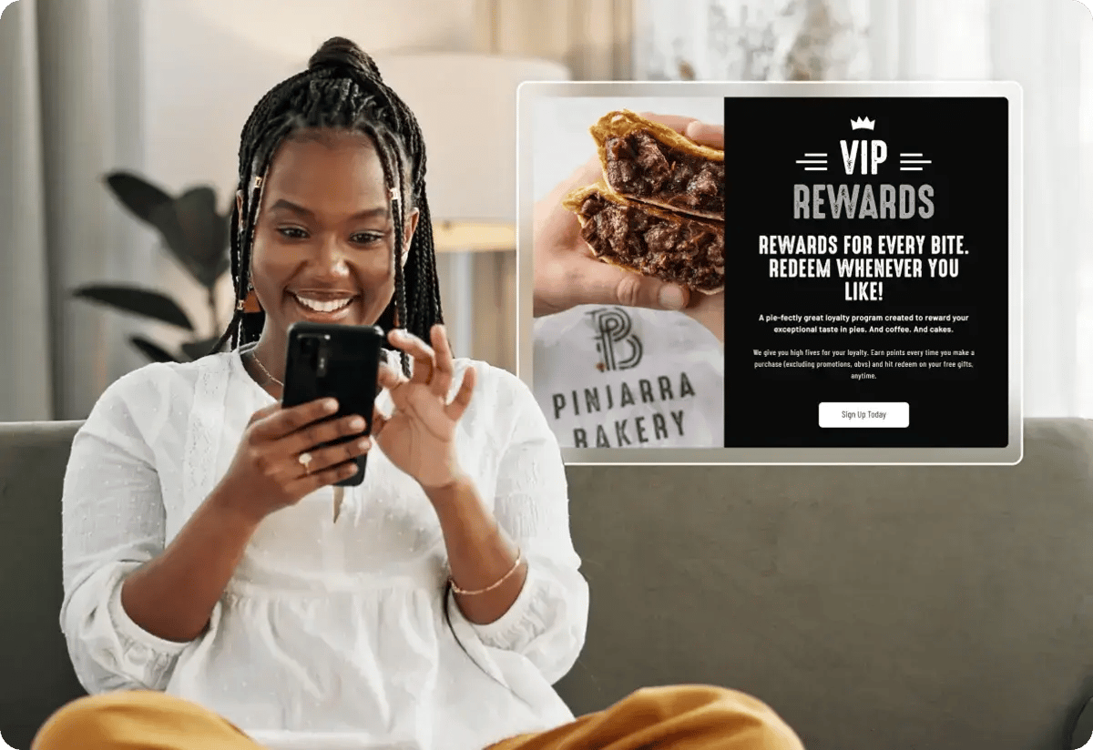 Woman reading an email showing her latest VIP rewards available at Pinjarra Bakery