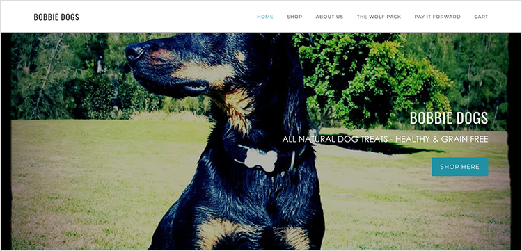 Bobbie Dogs website homepage with a large banner image of a black and tan dog.